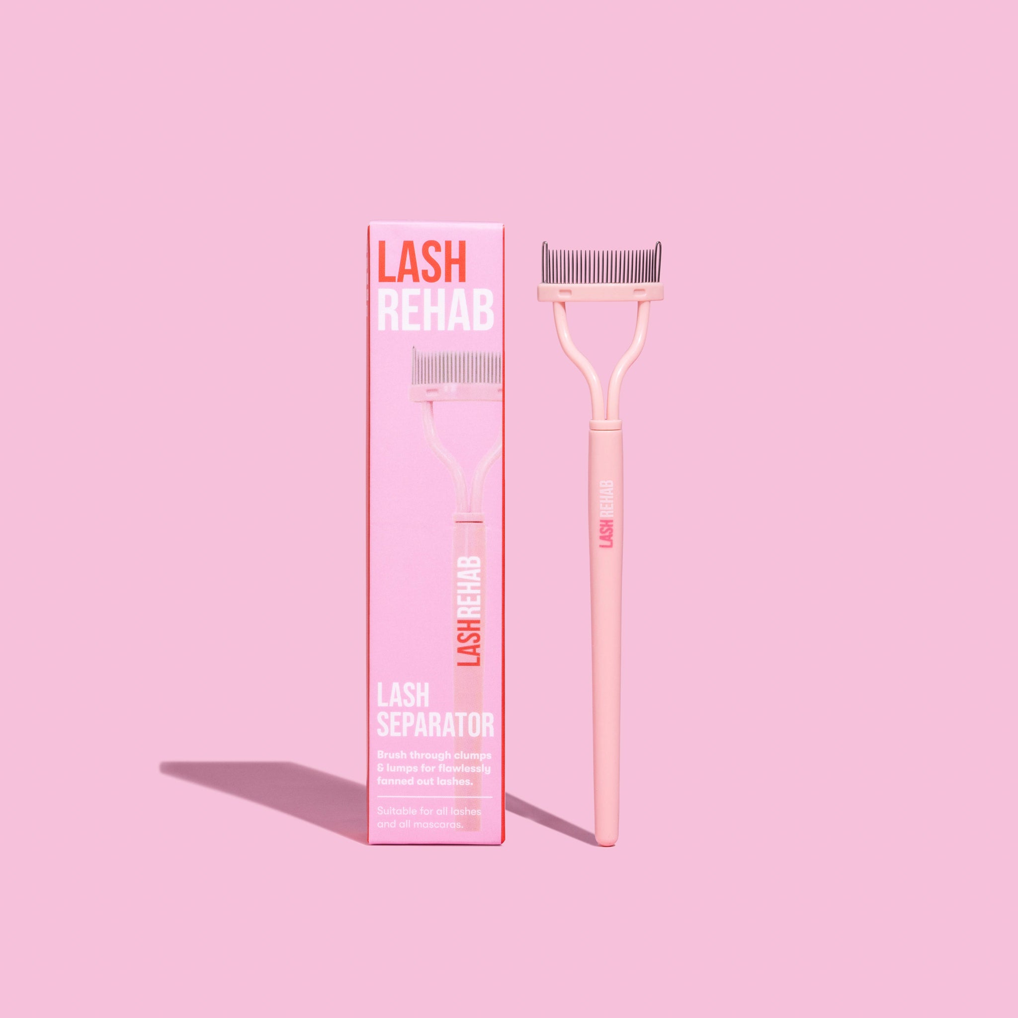 Lash Separator tool by The Lash Rehab with packaging – clump-free lash comb for mascara, beauty accessory on pink background.
