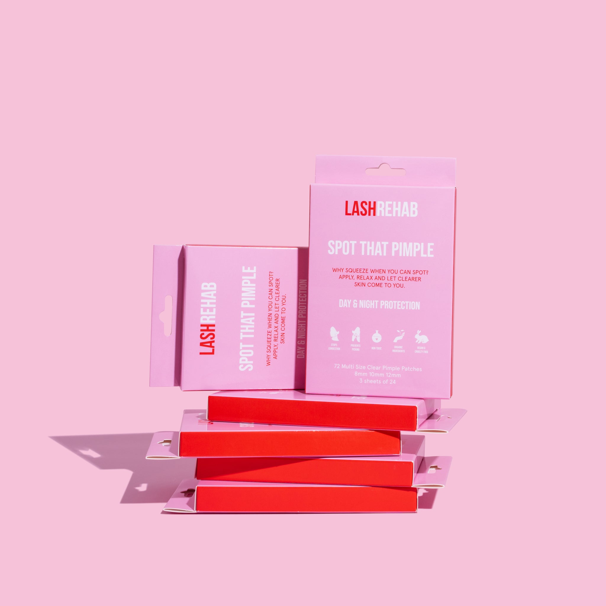 Lash Rehab Spot That Pimple wholesale set – 6 pink retail boxes of hydrocolloid acne patches stacked for resellers, skincare businesses, and beauty salons.