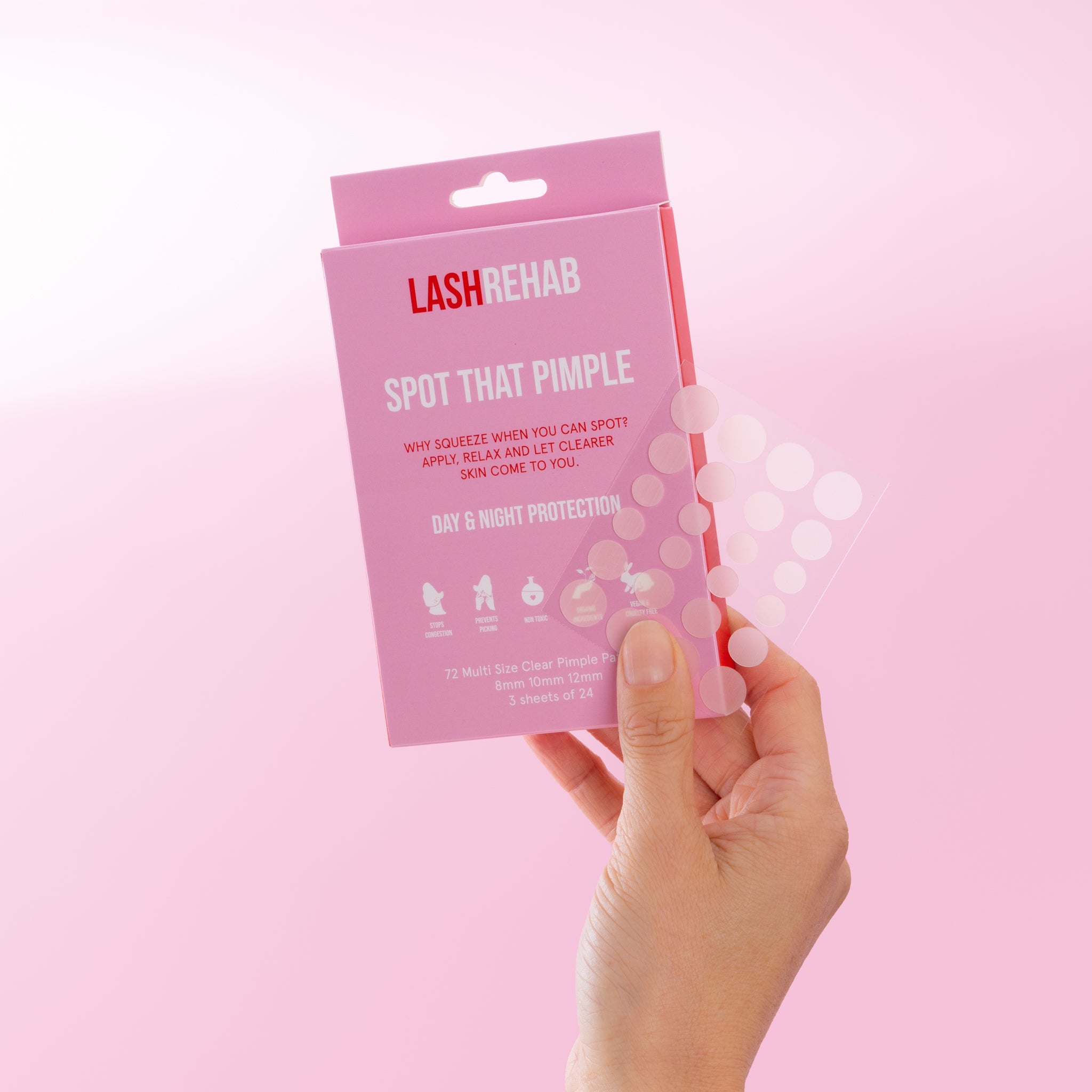 Lash Rehab Spot That Pimple patch set with hydrocolloid acne stickers displayed next to pink retail packaging.